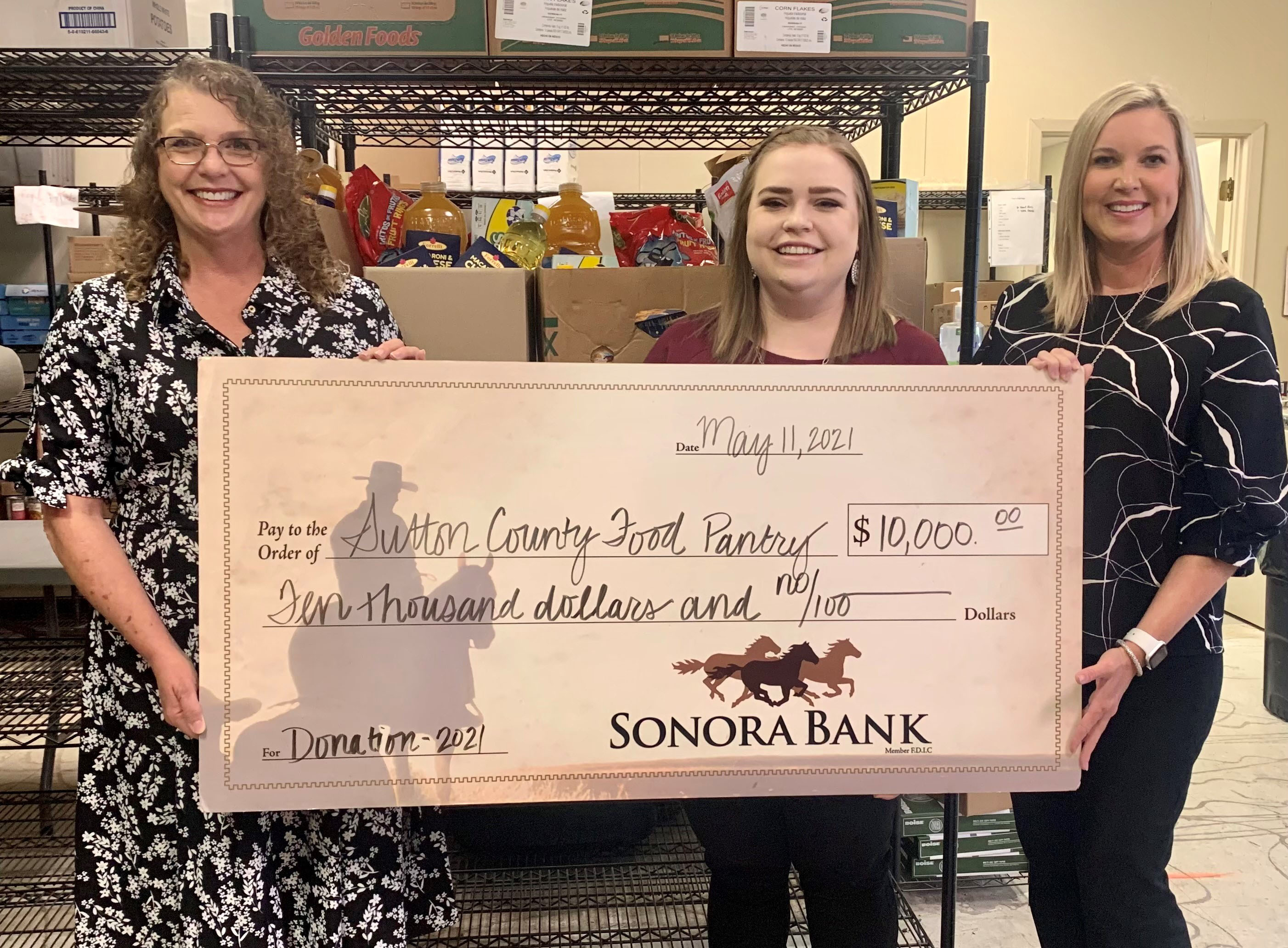 Sonora Bank team members present check to Sutton County Food Pantry