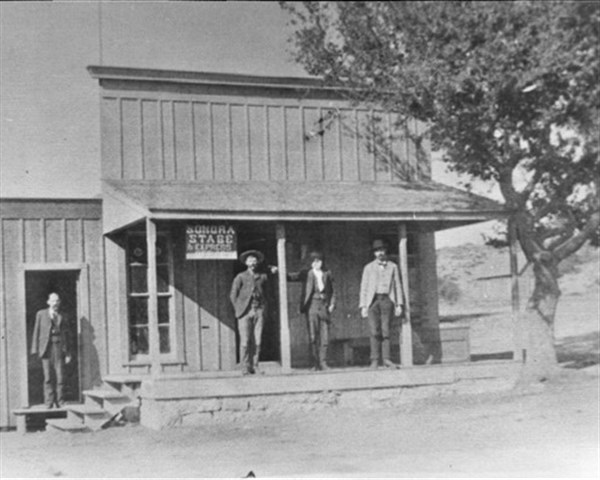 Men outside building in old Sonora