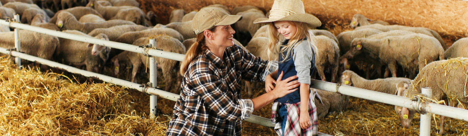 Girl with mom and sheep