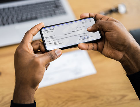 Man depositing check with phone