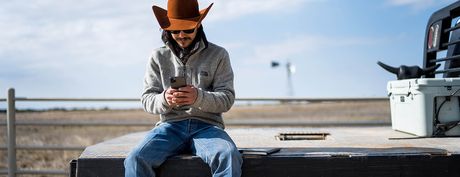 man on cell phone in field